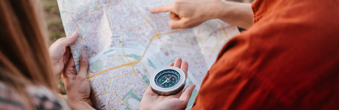 People mapping a route together, symbolizing understanding parents' retirement plans.