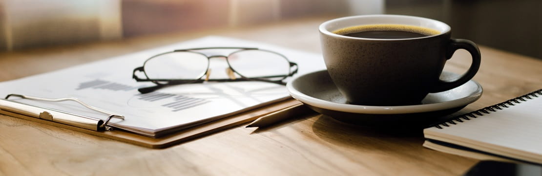 Workspace with retirement planning documents illustrating long-term Social Security planning.