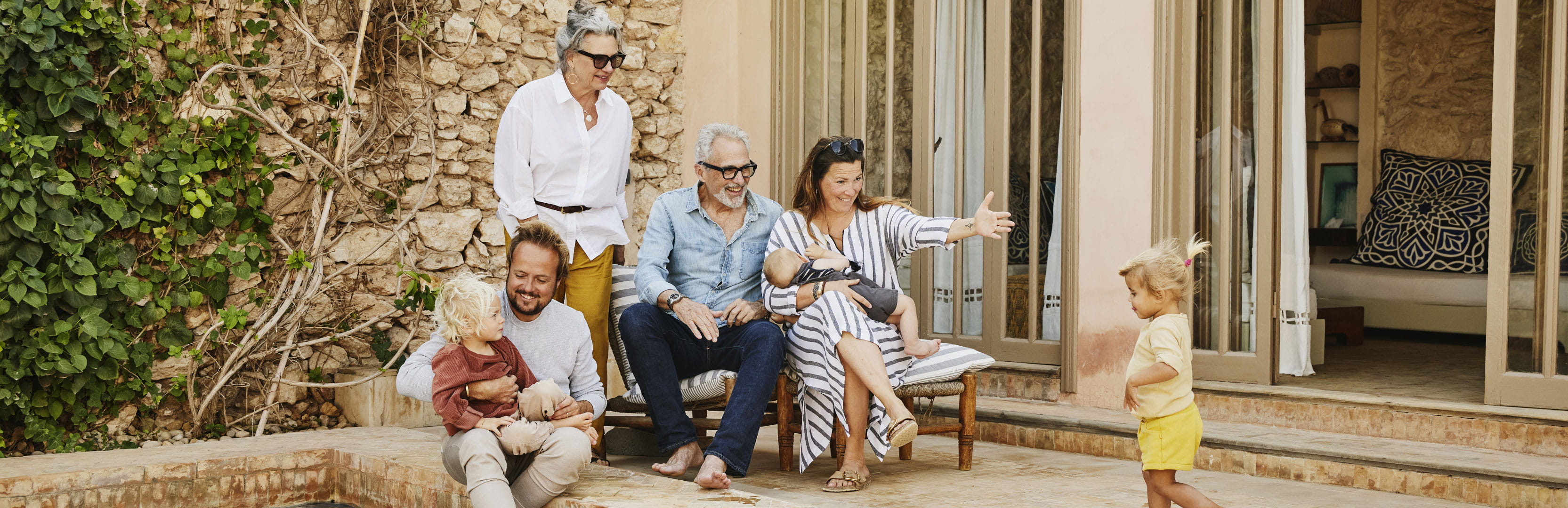 A multigenerational family gathers outdoors with young children, reflecting the many ways Americans build families through care, connection, and shared support beyond traditional roles.